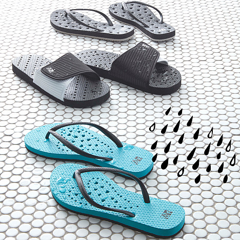 AquaFlops Men&#39;s Slide Shower Shoes in Grey/Black. View a larger version of this product image.