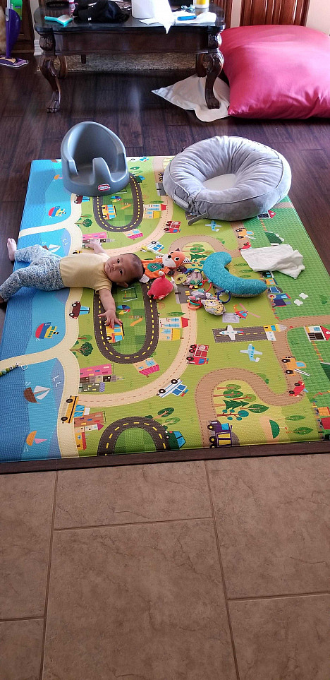 BABY CARE&trade; Large Baby Play Mat in Happy Village. View a larger version of this product image.