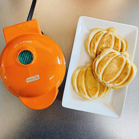 DASH&trade; Pumpkin Mini Waffle Maker in Orange. View a larger version of this product image.