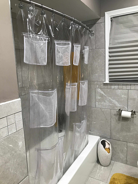Stuffits Vinyl Shower Curtain with Mesh Pockets in Clear. View a larger version of this product image.