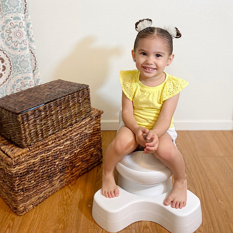 The First Years&trade; Super Pooper&trade; Plus Potty Training Seat in White. View a larger version of this product image.