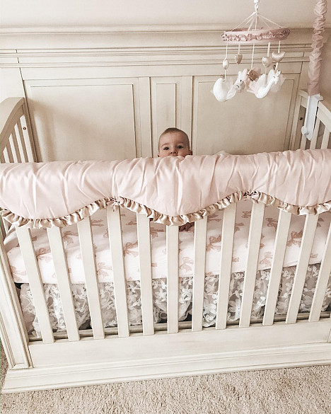The Peanutshell&trade; Grace Crib Rail Guard in Pink. View a larger version of this product image.